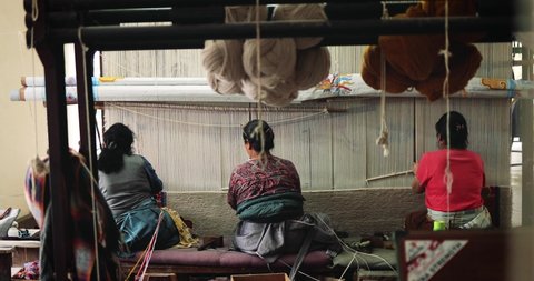 Likir/ India 27 October 2018  Tibetan women Weaving Handmade Silk Carpet in  India Likir
