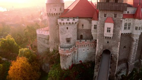 Famous attraction gothic Corvin Castle in Hunedoara Transylvania, Romania in autumn - aerial view from above