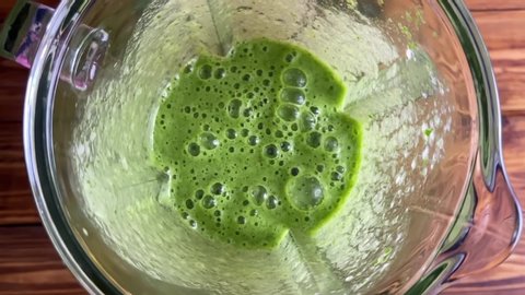 Healthy green smoothie blended with a blender