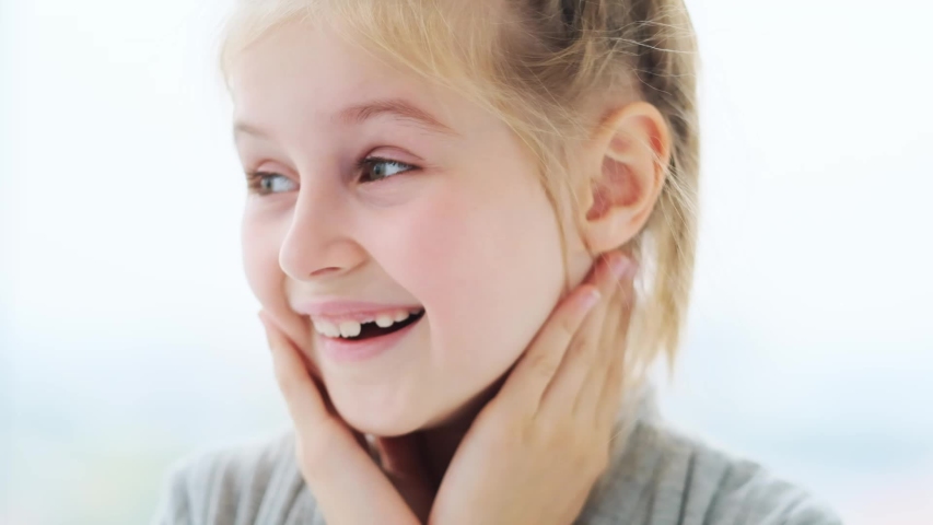 Close up on sincere smile of little girl