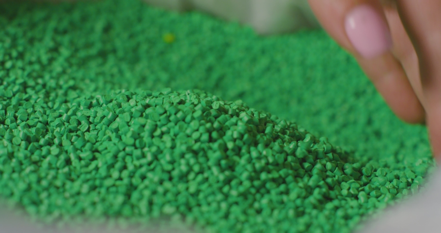 Green Granular plastic in the bag, slow motion | Shutterstock HD Video #1041352834