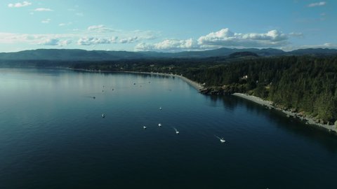 Aerial Drone Shot of West Coast of Canada on Vancouver Island in Sooke British Columbia with Salmon Fishing Boats Below