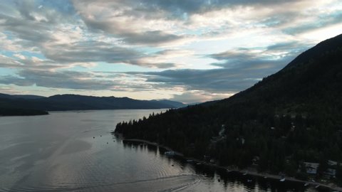 Aerial Drone Shot of Lake Front Beach Cabins in British Columbia Canada Shuswap Lake Beautiful Sunset
