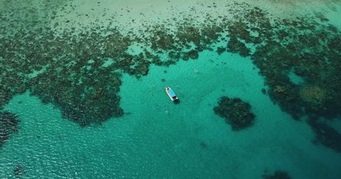 
Aerial Drone Shot of Boat with Snorkelers out on the Great Barrier Reef Wide Shot Revealing the Grand Reef Queensland Australia