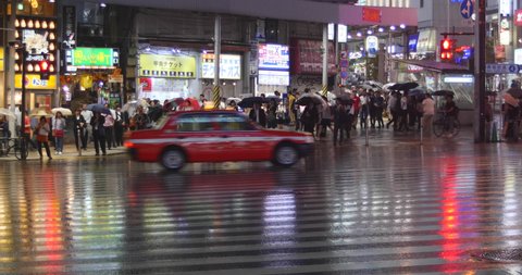 Tokyo, Japan. Circa October 2019: People Walking  In The Rain Downtown Tokyo, Japan. 