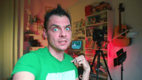 Blue-eyed excited surprised vlogger telling subscribers about global business crisis during covid-19 pandemic. Emotionally expresses thoughts, gesticulating in lockdown period. 
Forecasts for future.  - Powered by Shutterstock - Get 15% off with code: PIKWIZARD15