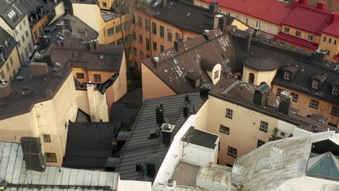 Stockholm old town gamla stan rooftops in aerial drone shot. Beautiful buildings from above