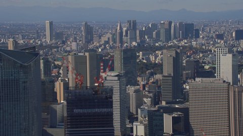 Tokyo, Japan circa-2018. Aerial view of Tokyo downtown buildings. Shot from helicopter with RED camera.