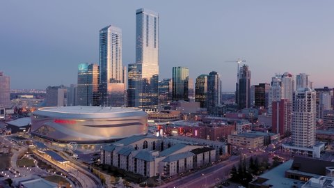 Aerial: Establishing shot of the Edmonton city skyline at sunset. Edmonton, Alberta, Canada. 1 April 2019 