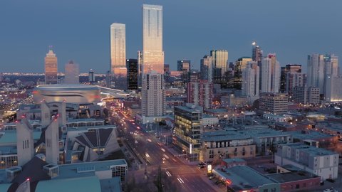 Aerial: Hyperlapse Timelapse of establishing shot of the Edmonton city skyline at night. Edmonton, Alberta, Canada. 1 April 2019