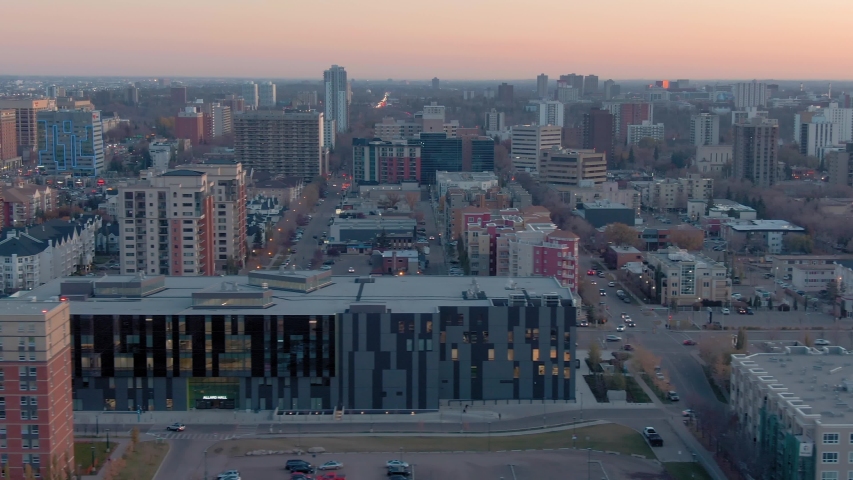 Aerial: Establishing shot of the Edmonton city skyline at sunset. Edmonton, Alberta, Canada. 