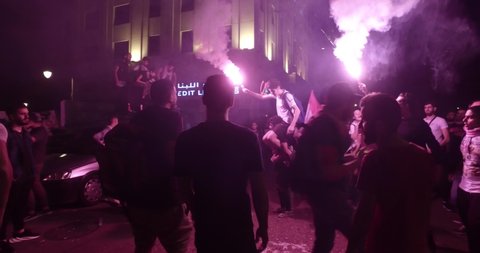 BEIRUT DOWNTOWN, LEBANON - NOV 16, 2019: Protesters chant patriotic songs
