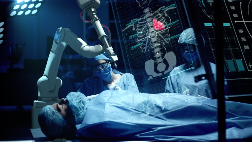 Team of surgeons perform a delicate operation using medical surgical robot while observing data on transparent screens. Modern medical equipment. Robotic arm for minimal invasive surgery. Royalty-Free Stock Footage #1041384412