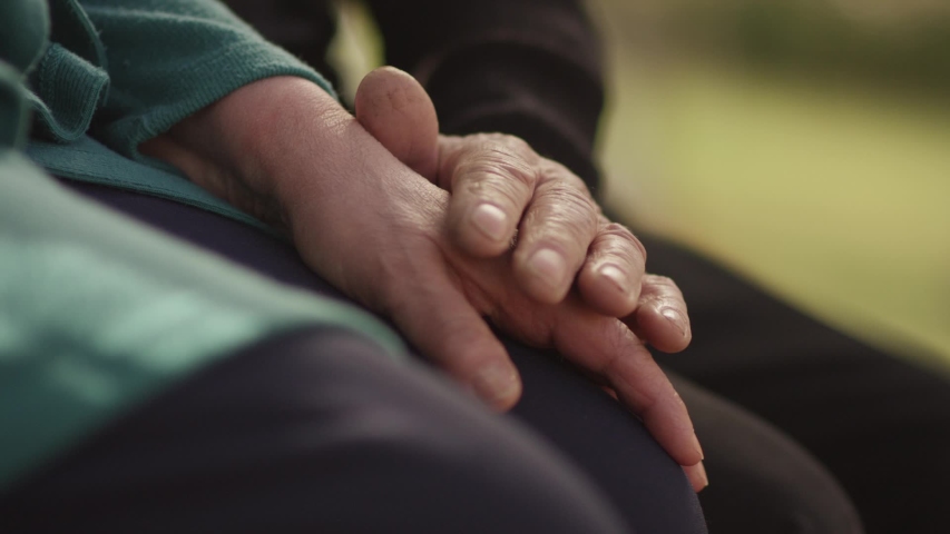 Senior older retired grandparents couple husband and wife holding hands , mature elderly family together . Support trust in marriage relationship . Health care concept . Close up , Slow Motion .
 | Shutterstock HD Video #1041394300