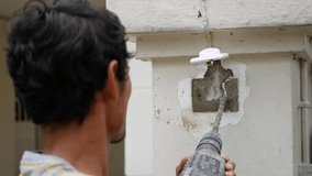 Drilling surface of a concrete pole for a wired doorbell installation