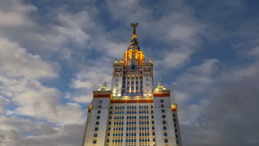 Main building of the Moscow State University on Sparrow Hills (on the background of moving clouds), Russia  