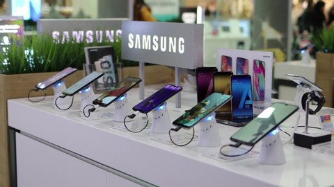 Belgrade, Serbia - November 20, 2019: Samsung Galaxy A10 A20e A30s A40 A50 A70 and A80 smartphones and smartwatches are shown on retail display in electronic store. Brand logo in the background.