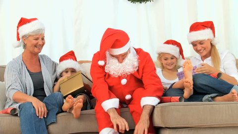 Family celebrating Christmas in the living room