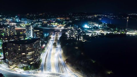 Aerial drone hyperlapse at night over Parkes Way, Canberra city, the Capital of Australia 