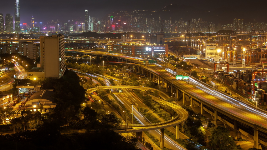 Hong Kong container port terminal and logistics center timelapse at night pan up