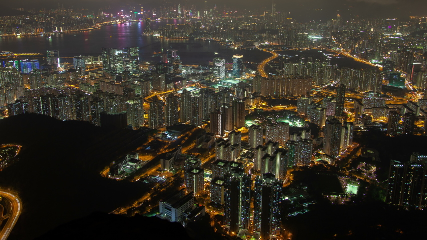 Hong Kong urban cityscape aerial skyline panorama timelapse at night pan up