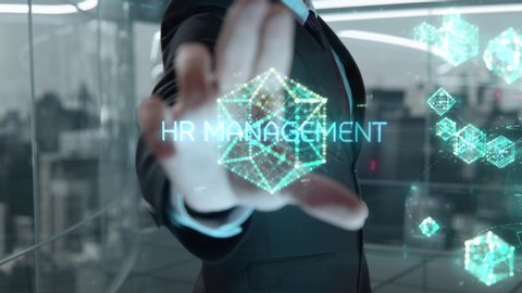 Businessman with HR Management hologram concept