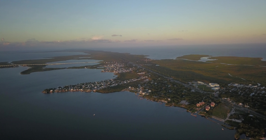 Drone view of a small suburb in the florida keys at sunset.