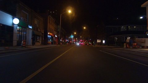 Toronto, Ontario, Canada November 2019 Driving plate POV low angle on Toronto city streets and highways at night