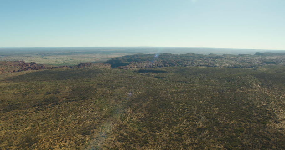 Aerial view of Kings Canyon Watarrka National Park Red Centre extreme terrain plateau rock formations Northern Territory Australia travel and tourism