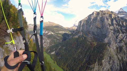 extreme paragliding point of view in swiss alps