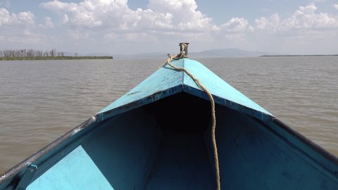 Bow of tourist vessel sailing over Chamo lake in Nechisar national park in South Ethiopia
