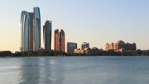 Abu Dhabi skyline on bright clear morning, Etihad Towers, Emirates Palace hotels in frame.