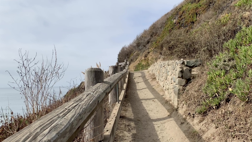 A hiking trail leads to a scenic vista point at Sand Dollar Beach in Big Sur, CA 