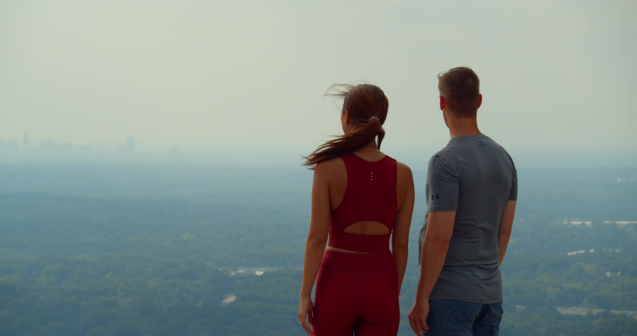 Young Couple at Top of Stone Mountain, Atlanta Hiking Trail, Skyline View