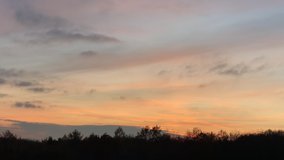 Colorful dusk time lapse far in the horizon in HD format for ten seconds.