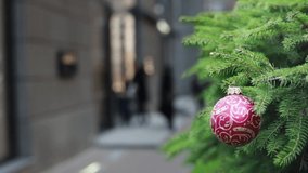 Defocused Christmas shoppers in winter city