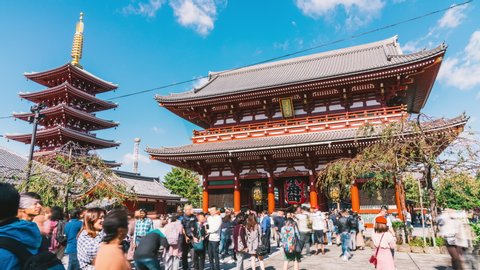 Tokyo, Japan - Nov 4, 2019: time-lapse of people walking in Senso-ji temple in Asakusa Tokyo, Japan. Japanese tourism landmark, Asia travel destination, or tourist attraction concept. Zoom out