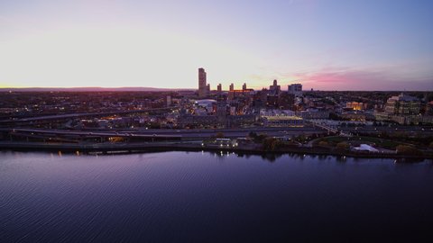 Albany New York Aerial v23 Reverse panning scenic downtown and river cityscape at sunset dusk - October 2017