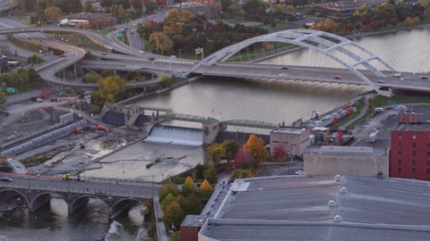 Rochester New York Aerial v34 Traversing over bridge, river cityscape at sunrise - October 2017