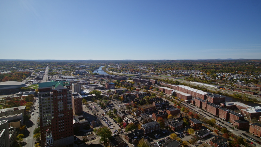 Manchester New Hampshire Aerial v1 Slow panoramic to birdseye to reverse downtown cityscape - October 2017