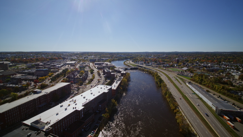 Manchester New Hampshire Aerial v2 Traveling north, fast over Merrimack River veering off to follow Canal street path - October 2017