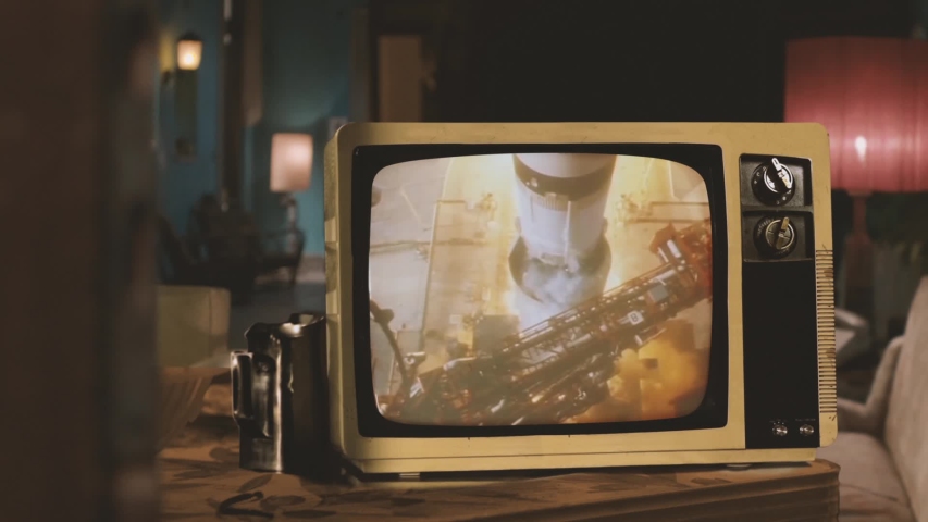 Color Footage of the Apollo 11 Launch seen on a Retro Television. Elements of this video furnished by NASA.   Royalty-Free Stock Footage #1041501769