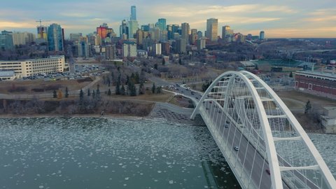 Aerial: Establishing shot of the Edmonton city skyline & traffic at sunrise. Edmonton, Alberta, Canada. 21 April 2019 
