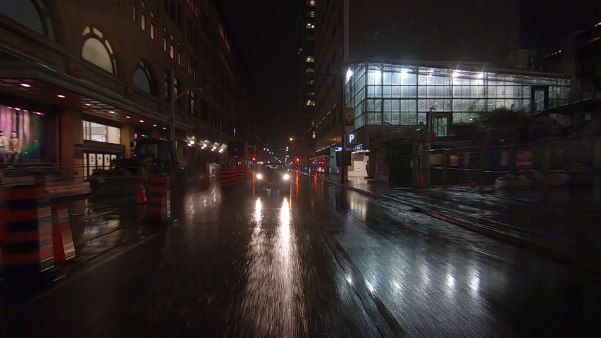 Toronto, Ontario, Canada November 21 2019 Driving plate rear view POV on a rainy at night on Toronto streets with car traffic and low visibility | Shutterstock HD Video #1041504826