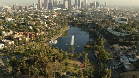 Los Angeles Downtown Sunset Skyline From Echo Park Lake Aerial Shot Forward Tilt Up