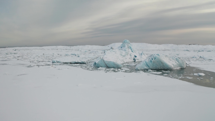 Aerial view of the J kuls rl n glacial lagoon and floating icebergs. The beginning of spring in Iceland