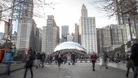 Chicago, IL - November 16th, 2019: Visitors and tourists gather daily at Cloud Gate Sculpture or 'The bean' to take selfie photos in the reflective surface in Millennium Park designed by Anish Kapoor.