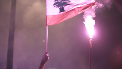 BEIRUT DOWNTOWN, LEBANON - NOV 22, 2019: Supporters of the Lebanese Revolution celebrate Lebanon's Independence Day and sing national anthems