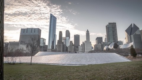 Chicago, IL - November 16th, 2019:  People cross the serpentine shaped BP pedestrian bridge connecting Millennium Park and Maggie Daley Park over Columbus Drive on a beautiful Saturday afternoon.