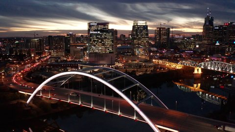 dusk flying clockwise around Korean War Vet Bridge revealing Nashville skyline